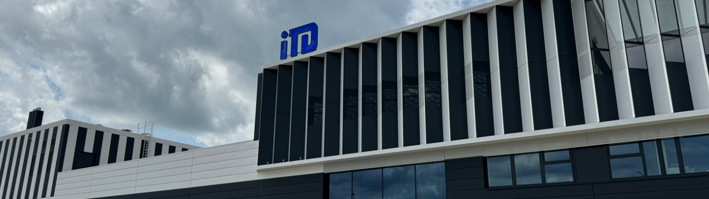 iTD headquarters building facade with logo