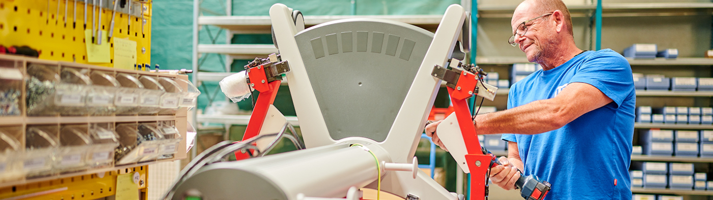 Worker assembling a medical cart